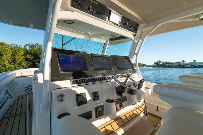 Slide: The Image of Helm of 2018 HCB 53 Suenos RXV boat with navigation screens and steering wheel. - 23