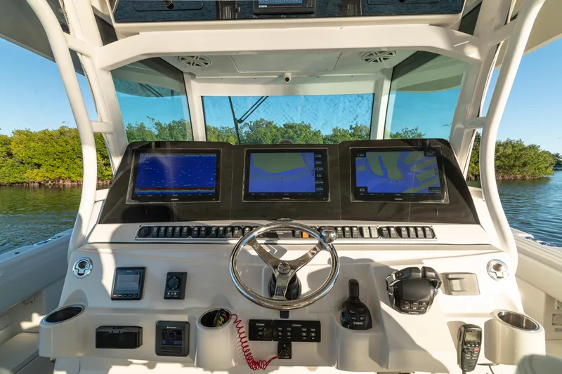 Slide: The Image of Helm of 2018 HCB 53 Suenos RXV with advanced navigation displays and controls. - 24