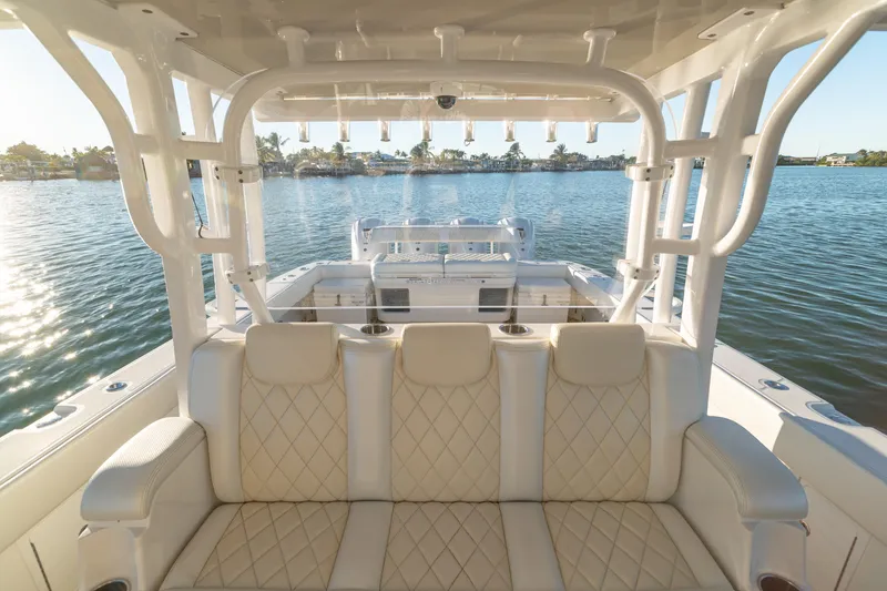 Slide: The Image of Luxurious interior of 2018 HCB 53 Suenos RXV boat on calm water. - 27