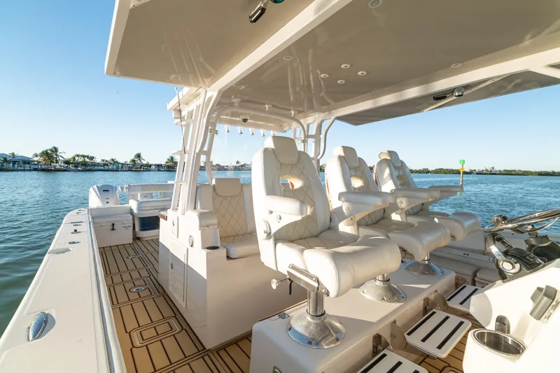 Slide: The Image of Luxury 2018 HCB 53 Suenos RXV boat interior with plush seating on calm waters. - 28