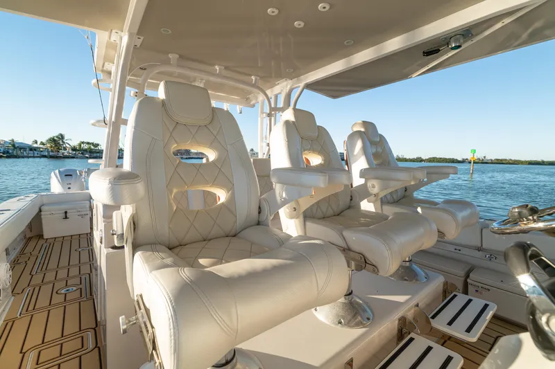 Slide: The Image of Luxurious seating on 2018 HCB 53 Suenos RXV boat, featuring elegant white upholstery. - 29