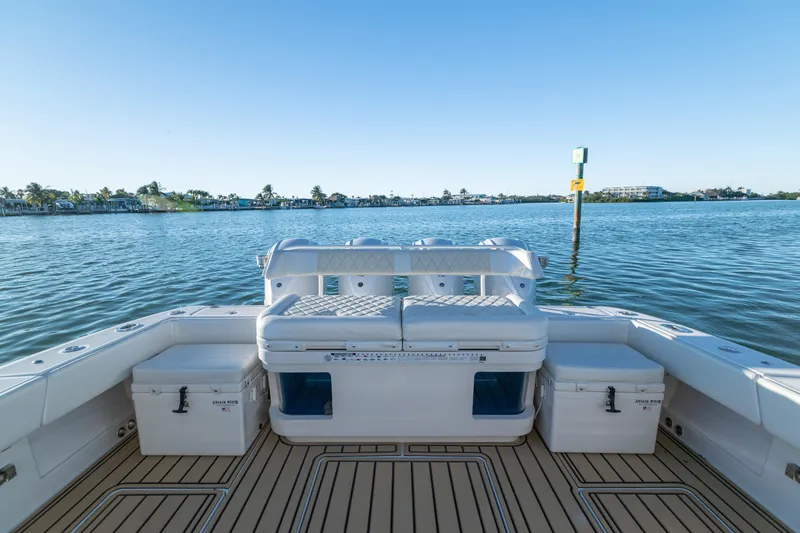 Slide: The Image of 2018 HCB 53 Suenos RXV boat interior with seating, on calm water. - 34