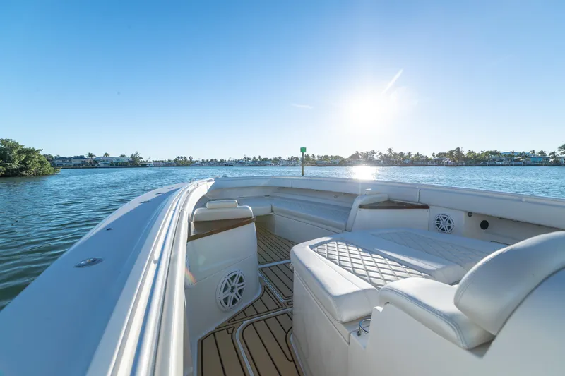 Slide: The Image of 2018 HCB 53 Suenos RXV boat interior with luxurious seating, cruising on a sunny day. - 40