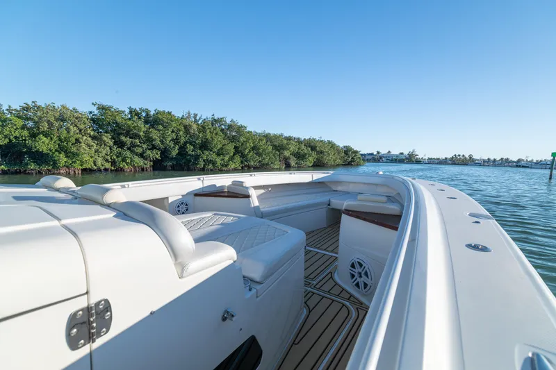 Slide: The Image of 2018 HCB 53 Suenos RXV boat with luxurious seating on calm water. - 41