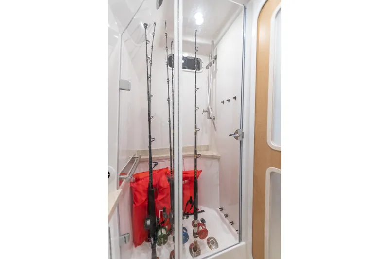 Slide: The Image of Interior of 2018 HCB 53 Suenos RXV boat with fishing rod storage. - 49