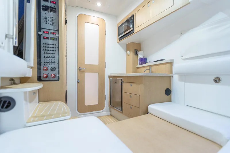 Slide: The Image of 2018 HCB 53 Suenos RXV interior with modern kitchen and control panel. - 52