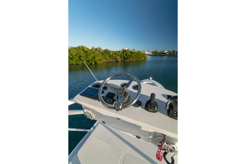Slide: The Image of Helm of 2018 HCB 53 Suenos RXV boat with scenic water view. - 55