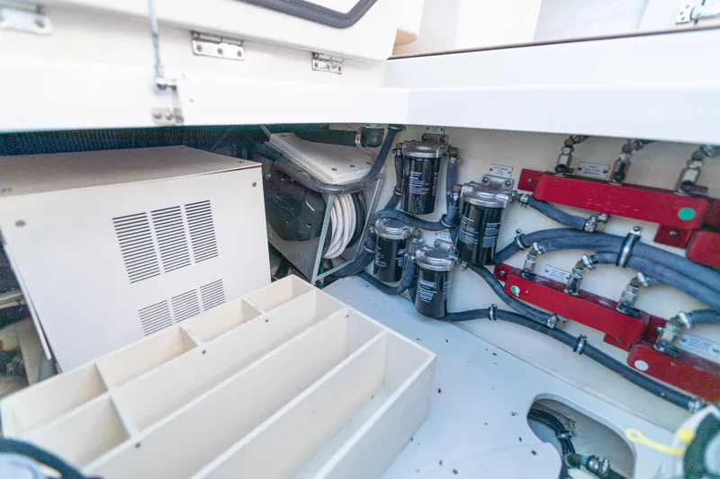 Slide: The Image of Engine compartment of 2018 HCB 53 Suenos RXV with filters and wiring. - 58