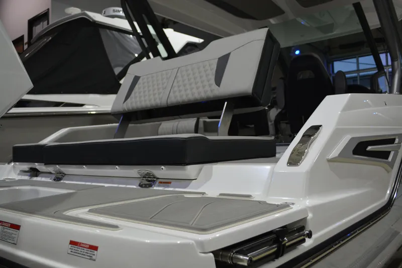 Slide: The Image of 2026 Monterey Elite 25 OB boat interior with sleek seating and modern design. - 10