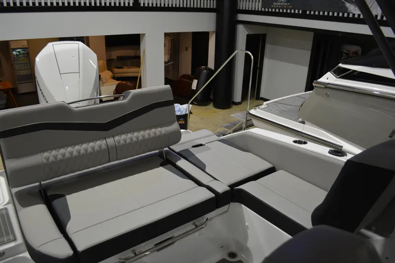 Slide: The Image of Luxurious seating on 2026 Monterey Elite 25 OB boat, showcasing modern design and comfort. - 11