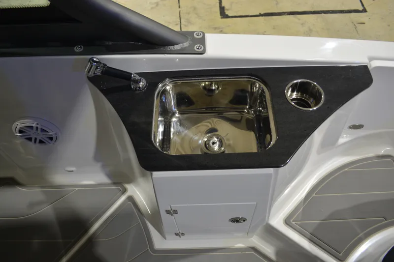 Slide: The Image of Luxury sink area on 2026 Monterey Elite 25 OB boat, featuring sleek design and modern fixtures. - 15