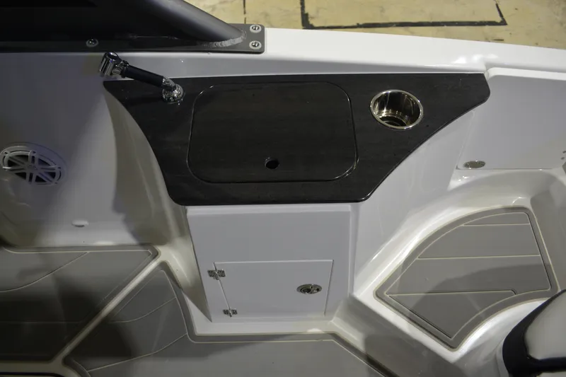 Slide: The Image of Interior of 2026 Monterey Elite 25 OB boat with sink and storage. - 16