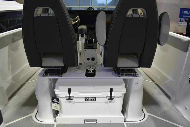 Slide: The Image of 2026 Monterey Elite 25 OB boat interior with Yeti cooler and dual seats. - 18
