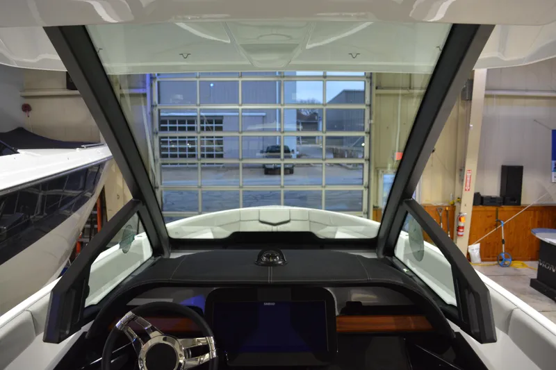 Slide: The Image of Interior view of 2026 Monterey Elite 25 OB boat, showcasing steering wheel and dashboard. - 21