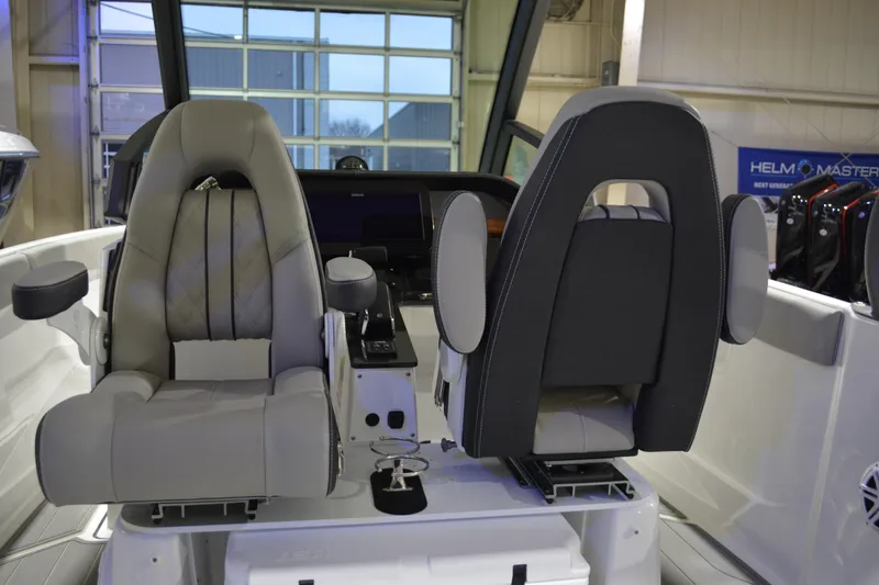 Slide: The Image of 2026 Monterey Elite 25 OB boat interior with luxurious seating and modern helm controls. - 24