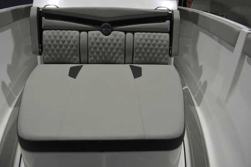 Slide: The Image of 2026 Monterey Elite 25 OB boat interior with cushioned seating and modern design. - 28