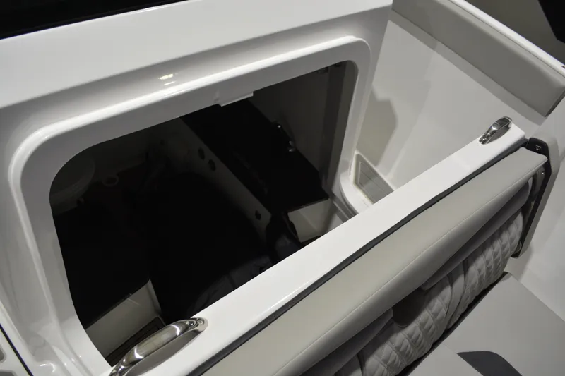 Slide: The Image of Storage compartment in 2026 Monterey Elite 25 OB boat, featuring sleek white interior design. - 35