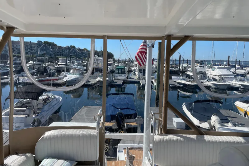 Slide: The Image of View from 1999 Mainship 430 Trawler overlooking marina with numerous docked boats. - 15