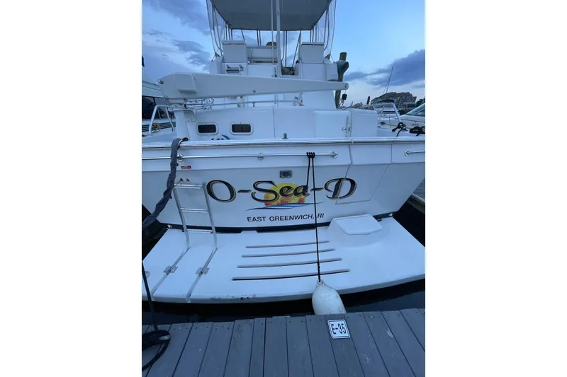 Slide: The Image of 1999 Mainship 430 Trawler docked, rear view with "O-Sea-D" name, East Greenwich, RI. - 18