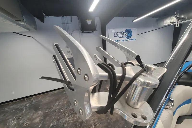 Slide: The Image of 2014 Malibu Wakesetter 24 MXZ wakeboard rack in showroom. - 14