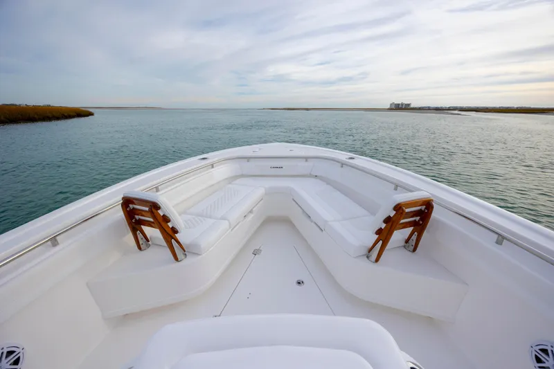 Slide: The Image of 2026 Caymas 291 boat with spacious seating on calm water. - 10