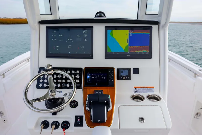 Slide: The Image of 2026 Caymas 291 boat dashboard with advanced navigation and control systems. - 23