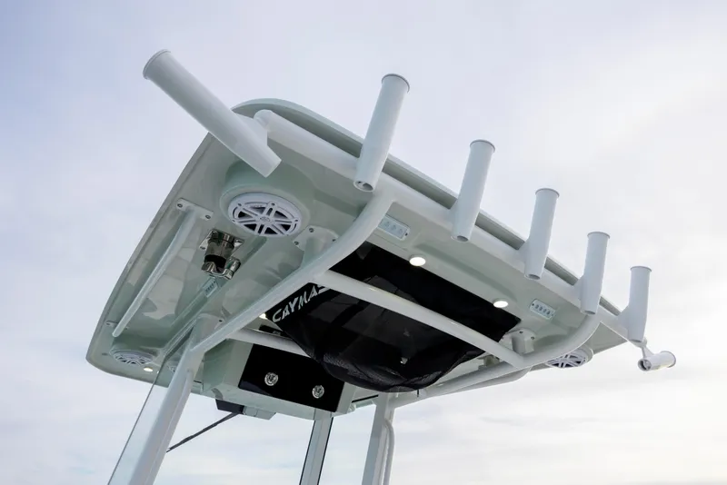 Slide: The Image of 2026 Caymas 291 boat top view with rod holders and speakers. - 26