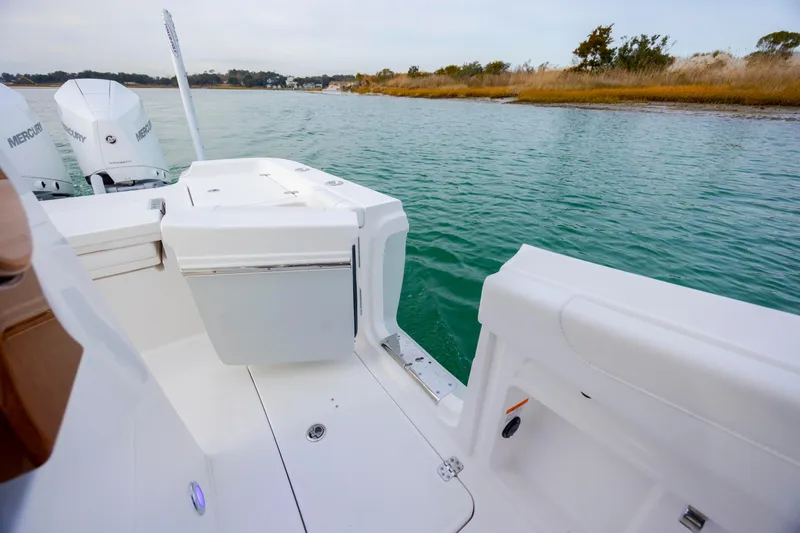 Slide: The Image of 2026 Caymas 291 boat with Mercury engines on calm water. - 35