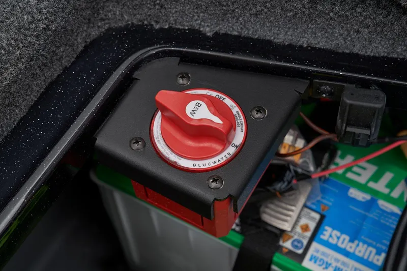 Slide: The Image of 2026 Ranger Z521R Cup-Equipped boat battery compartment with green batteries and wiring. - 56