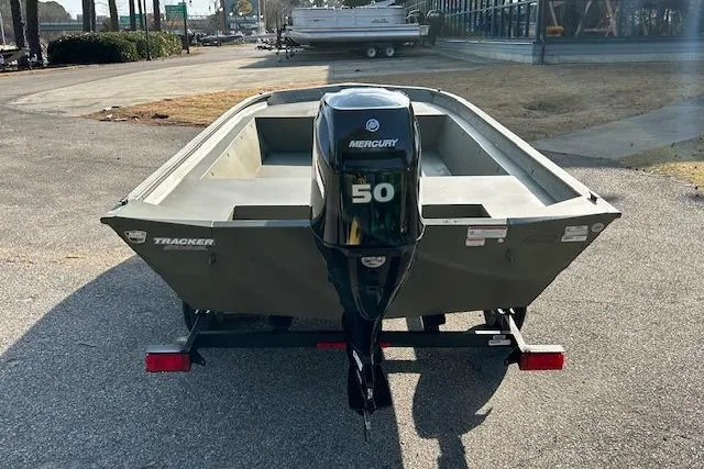 Slide: The Image of 2026 Tracker Grizzly 1860 Utility boat with Mercury 50 outboard motor on trailer. - 2