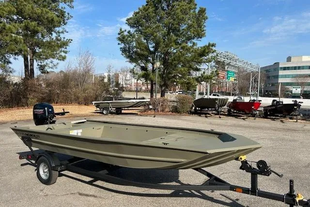 Slide: The Image of 2026 Tracker Grizzly 1860 Utility boat on trailer in outdoor setting. - 4