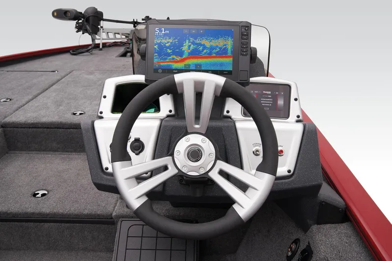 Slide: The Image of 2025 Tracker Savage 215 boat interior with four gray and red seats. - 31