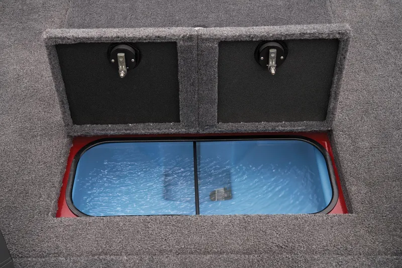 Slide: The Image of 2025 Tracker Savage 215 boat interior with storage compartments and seating. - 51