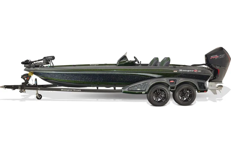 Slide: The Image of 2026 Ranger Z521 boat with Mercury Pro XS engine, parked outdoors on a sunny day. - 2