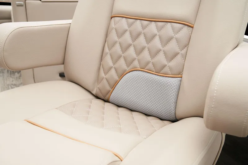 Slide: The Image of 2025 Ranger Reata 220FC boat interior with two luxurious gray captain chairs. - 21