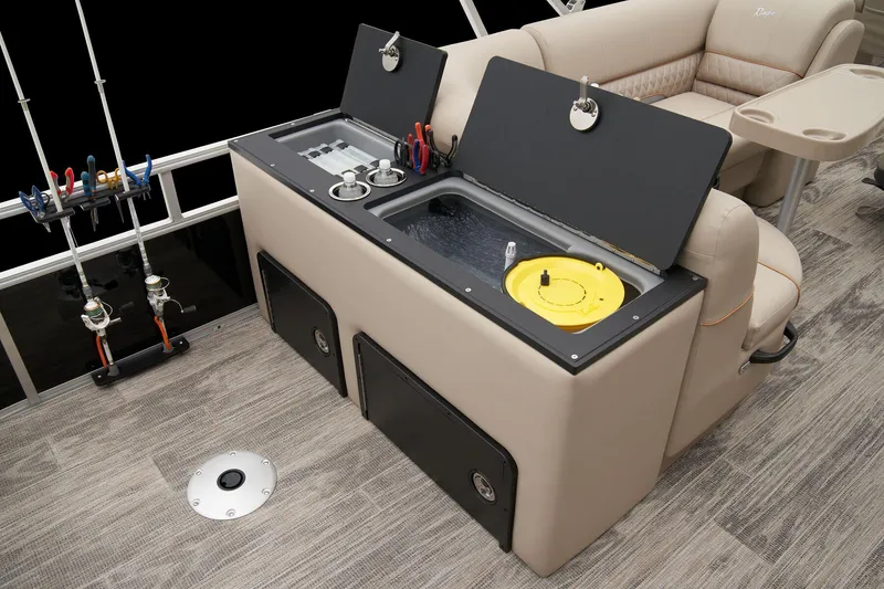 Slide: The Image of 2025 Ranger Reata 220FC boat interior with cup holders and storage compartment. - 50