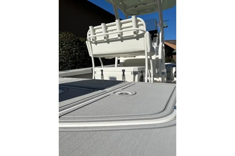 Slide: The Image of 2026 Mako 24 APEX boat interior with seating and storage compartments. - 10