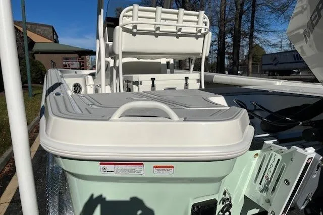 Slide: The Image of 2026 Mako 24 APEX boat interior with seating and storage compartments. - 7