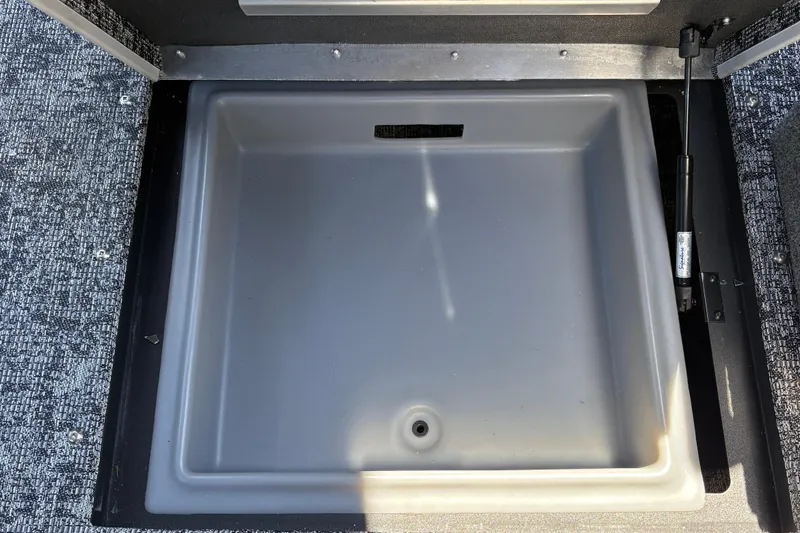 Slide: The Image of Storage compartment in 2026 Tracker Targa V-18 Combo boat, featuring durable interior design. - 33
