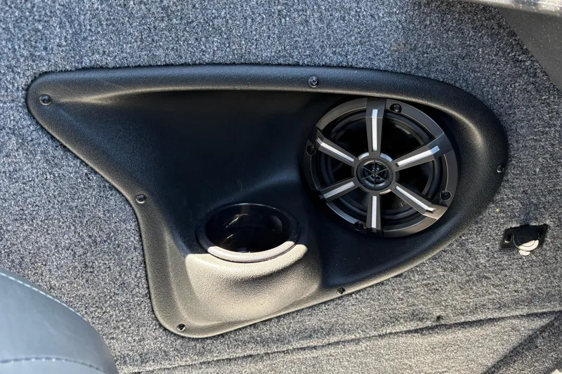 Slide: The Image of Speaker and cup holder in 2026 Tracker Targa V-18 Combo boat interior. - 54