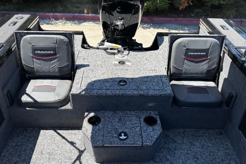 Slide: The Image of 2026 Tracker Targa V-18 Combo boat interior with two cushioned seats and storage compartments. - 15