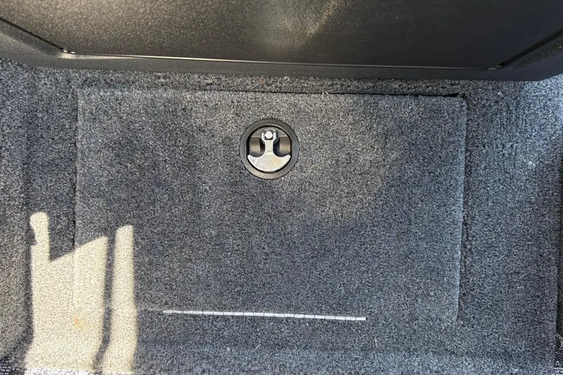 Slide: The Image of Carpeted storage compartment in 2026 Tracker Targa V-18 Combo boat. - 44