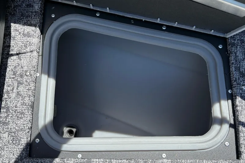 Slide: The Image of Storage compartment in 2026 Tracker Targa V-18 Combo boat, featuring a secure lid and durable design. - 32