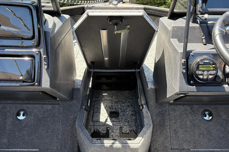 Slide: The Image of 2026 Tracker Targa V-18 Combo boat interior with open storage compartment. - 28