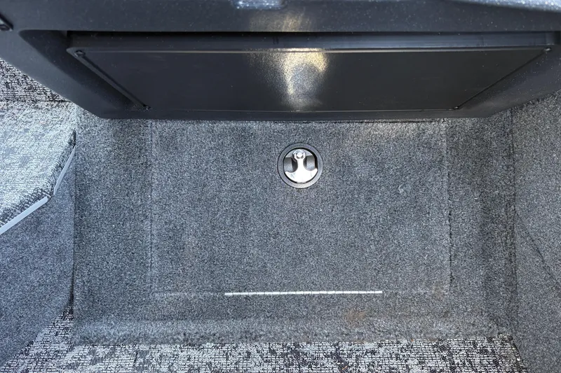 Slide: The Image of Carpeted storage compartment in 2026 Tracker Targa V-18 Combo boat. - 49