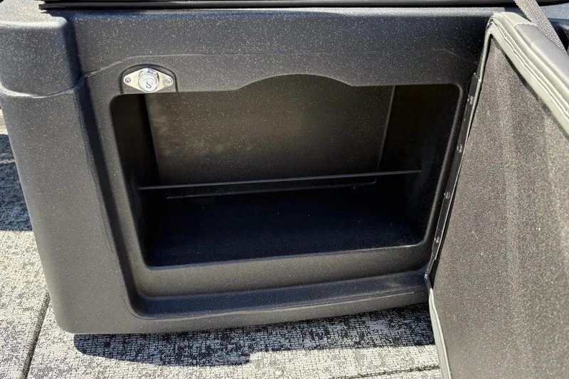Slide: The Image of Open storage compartment in 2026 Tracker Targa V-18 Combo boat. - 22