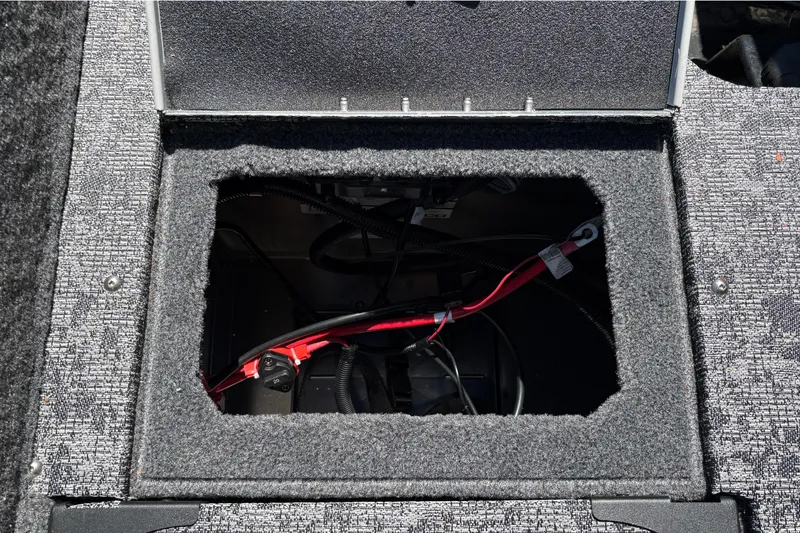 Slide: The Image of Open storage compartment in 2026 Tracker Targa V-18 Combo boat, showing wiring and interior details. - 41