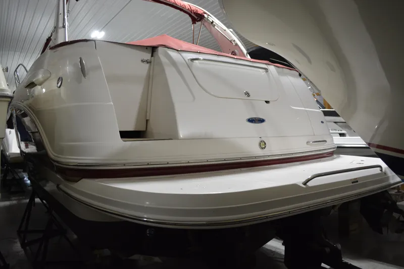 Slide: The Image of 2004 Chaparral Signature 290 boat in indoor storage, rear view. - 15