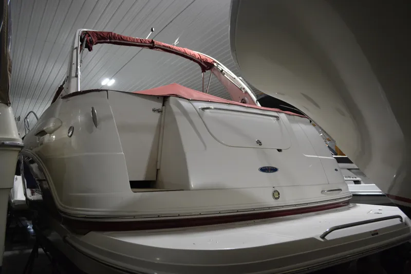 Slide: The Image of 2004 Chaparral Signature 290 boat in indoor storage, rear view. - 16