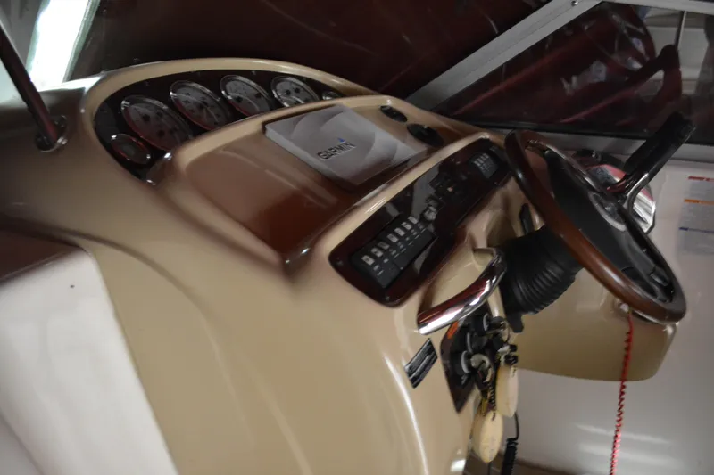 Slide: The Image of 2004 Chaparral Signature 290 dashboard with steering wheel and instrument panel. - 27